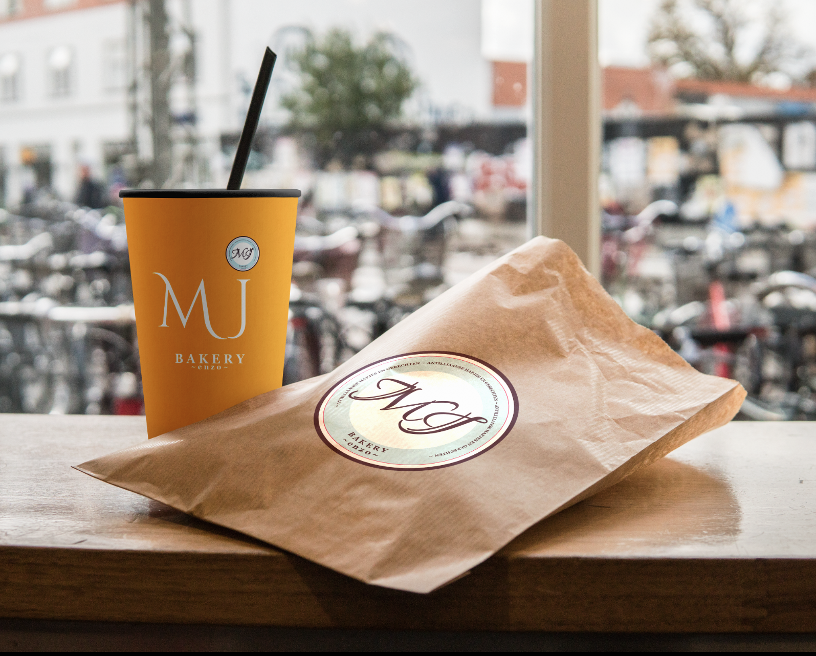 MJ Bakery website displayed on a laptop